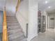 Open staircase leading to the upper level with convenient access to the kitchen at 2743 Peekskill Ave, Henderson, NV 89052