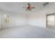 Spacious carpeted bedroom with a ceiling fan and window at 2894 Carmelo Dr, Henderson, NV 89052