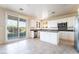 Bright kitchen boasts white cabinetry, granite countertops, and stainless steel appliances at 2894 Carmelo Dr, Henderson, NV 89052