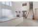 Bright and airy living room with a fireplace, large windows, and tile flooring at 2894 Carmelo Dr, Henderson, NV 89052