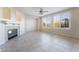 Bright living room with a fireplace, tile flooring, ceiling fan, and windows with a view at 2894 Carmelo Dr, Henderson, NV 89052