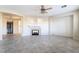 Spacious living room with a fireplace, tile floors, and arched entryways at 2894 Carmelo Dr, Henderson, NV 89052