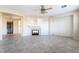 Spacious living room with a fireplace, tile floors, and arched entryways at 2894 Carmelo Dr, Henderson, NV 89052