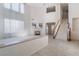 Bright and airy living room with a fireplace, large windows, and tile flooring at 2894 Carmelo Dr, Henderson, NV 89052
