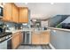 Updated kitchen featuring stainless steel appliances, light wood cabinets, and a view into the dining area at 3103 Sunrise Cove Ave, North Las Vegas, NV 89031