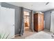 Cozy main bedroom featuring an en-suite bathroom and ample closet space with stylish gray walls and neutral flooring at 3103 Sunrise Cove Ave, North Las Vegas, NV 89031