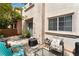Cozy outdoor patio featuring comfortable seating, lush plants, and a private setting, great for entertaining at 3103 Sunrise Cove Ave, North Las Vegas, NV 89031