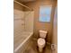 Compact bathroom with a shower-tub combo and a toilet next to the window at 3481 Bradano Ln, Henderson, NV 89044