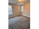 Bright bedroom features neutral carpet, two windows, and neutral colored walls at 3481 Bradano Ln, Henderson, NV 89044