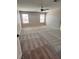 Spacious bedroom with large windows, neutral walls, and plush carpeting at 3481 Bradano Ln, Henderson, NV 89044