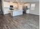 Bright and airy kitchen with stainless appliances, hardwood floors and center island at 3481 Bradano Ln, Henderson, NV 89044