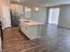 Spacious kitchen with a center island, stainless steel appliances, and hardwood floors at 3481 Bradano Ln, Henderson, NV 89044