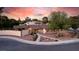 Aerial view of a single-story home showcasing the desert landscaping, front courtyard, and proximity to palm trees at 3597 Cochise Ln, Las Vegas, NV 89169