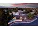 An aerial view of the property featuring a pool, outdoor kitchen, and landscaped backyard with mountain views at 3597 Cochise Ln, Las Vegas, NV 89169