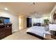 Carpeted main bedroom with furniture and an entrance to the main bath at 3597 Cochise Ln, Las Vegas, NV 89169