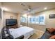 Bedroom with large windows, a ceiling fan, and a comfortable leather couch at 3597 Cochise Ln, Las Vegas, NV 89169