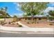Charming single-story home with desert landscaping and a walkway leading to a bright yellow front door at 3597 Cochise Ln, Las Vegas, NV 89169