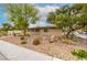 Charming single-story home with desert landscaping and a walkway leading to the front door at 3597 Cochise Ln, Las Vegas, NV 89169