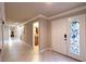 Bright foyer featuring tiled floors, decorative glass in the front door and neutral walls at 3597 Cochise Ln, Las Vegas, NV 89169