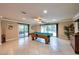 Spacious game room with a pool table and sliding doors leading to the backyard pool at 3597 Cochise Ln, Las Vegas, NV 89169