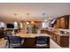 Spacious open floorplan kitchen with central island, stainless appliances, and custom wood cabinets at 3597 Cochise Ln, Las Vegas, NV 89169