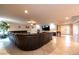 Expansive living room with a large sectional sofa, tile flooring, and a ceiling fan at 3597 Cochise Ln, Las Vegas, NV 89169