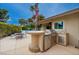 Built-in outdoor kitchen with grill, sink, and counter space, perfect for entertaining at 3597 Cochise Ln, Las Vegas, NV 89169