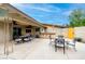 Spacious patio with dining area, outdoor kitchen, and access to the backyard at 3597 Cochise Ln, Las Vegas, NV 89169