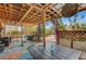Comfortable covered backyard patio featuring ample seating and outdoor lighting at 3744 Alpine Bypass Ave, North Las Vegas, NV 89081