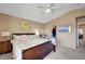 Cozy bedroom featuring a ceiling fan, walk-in closet, and bright natural light at 3744 Alpine Bypass Ave, North Las Vegas, NV 89081