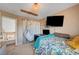 Unique bedroom featuring a hanging hammock chair, and bright natural light at 3744 Alpine Bypass Ave, North Las Vegas, NV 89081