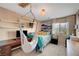 Unique bedroom featuring a hanging hammock chair, and bright natural light at 3744 Alpine Bypass Ave, North Las Vegas, NV 89081