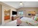 Bright bedroom with large screen TV, en suite bath, and bright natural light at 3744 Alpine Bypass Ave, North Las Vegas, NV 89081