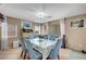 Cozy dining area with seating for six, ample natural light, and neutral wall colors for a versatile space at 3744 Alpine Bypass Ave, North Las Vegas, NV 89081