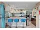 Kitchen featuring stone countertops, stainless appliances, bar seating, and updated cabinetry at 3744 Alpine Bypass Ave, North Las Vegas, NV 89081