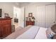 Bedroom with carpet, dresser, and open bathroom view; complete with a closet at 408 Middlestone Ave, Henderson, NV 89011
