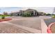Community entrance with a circular driveway and elegant landscaping at 408 Middlestone Ave, Henderson, NV 89011