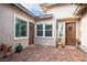 Inviting front courtyard featuring decorative potted plants and well-maintained brick pavers at 408 Middlestone Ave, Henderson, NV 89011