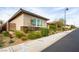 Modern home exterior with manicured landscaping and a well-maintained lawn at 408 Middlestone Ave, Henderson, NV 89011
