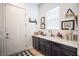 Laundry room features countertop space with sink, decor, window for natural light, and dark cabinets at 408 Middlestone Ave, Henderson, NV 89011