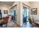 A home interior featuring sliding glass doors leading to an outdoor patio and elegant furniture at 408 Middlestone Ave, Henderson, NV 89011