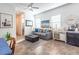 Bright living room featuring a comfortable gray sofa, neutral decor, and stylish accents and artwork at 408 Middlestone Ave, Henderson, NV 89011