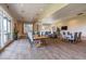 Community meeting room with large windows, several tables, and comfortable seating for residents at 408 Middlestone Ave, Henderson, NV 89011