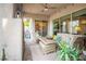 Inviting covered patio with cozy seating, views of the garden, and outdoor lights at 408 Middlestone Ave, Henderson, NV 89011