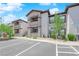 Condominium exterior view featuring well-maintained landscaping, accessible parking and two-story building design at 45 Maleena Mesa St # 1113, Henderson, NV 89074