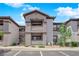 Exterior of the condo featuring a covered balcony and stairs at 45 Maleena Mesa St # 1113, Henderson, NV 89074