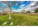 Large green space in Traverse Point with grass, walking path, and distant buildings at 45 Maleena Mesa St # 1113, Henderson, NV 89074