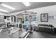 Gym showcasing free weights, weight machines, and bright windows overlooking the community pool at 45 Maleena Mesa St # 1113, Henderson, NV 89074