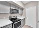 Cozy kitchen featuring modern appliances, gray cabinets, and white countertops for a sleek design at 45 Maleena Mesa St # 1113, Henderson, NV 89074