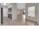 Open kitchen and living area with neutral tones and tile flooring, creating a seamless flow at 45 Maleena Mesa St # 1113, Henderson, NV 89074